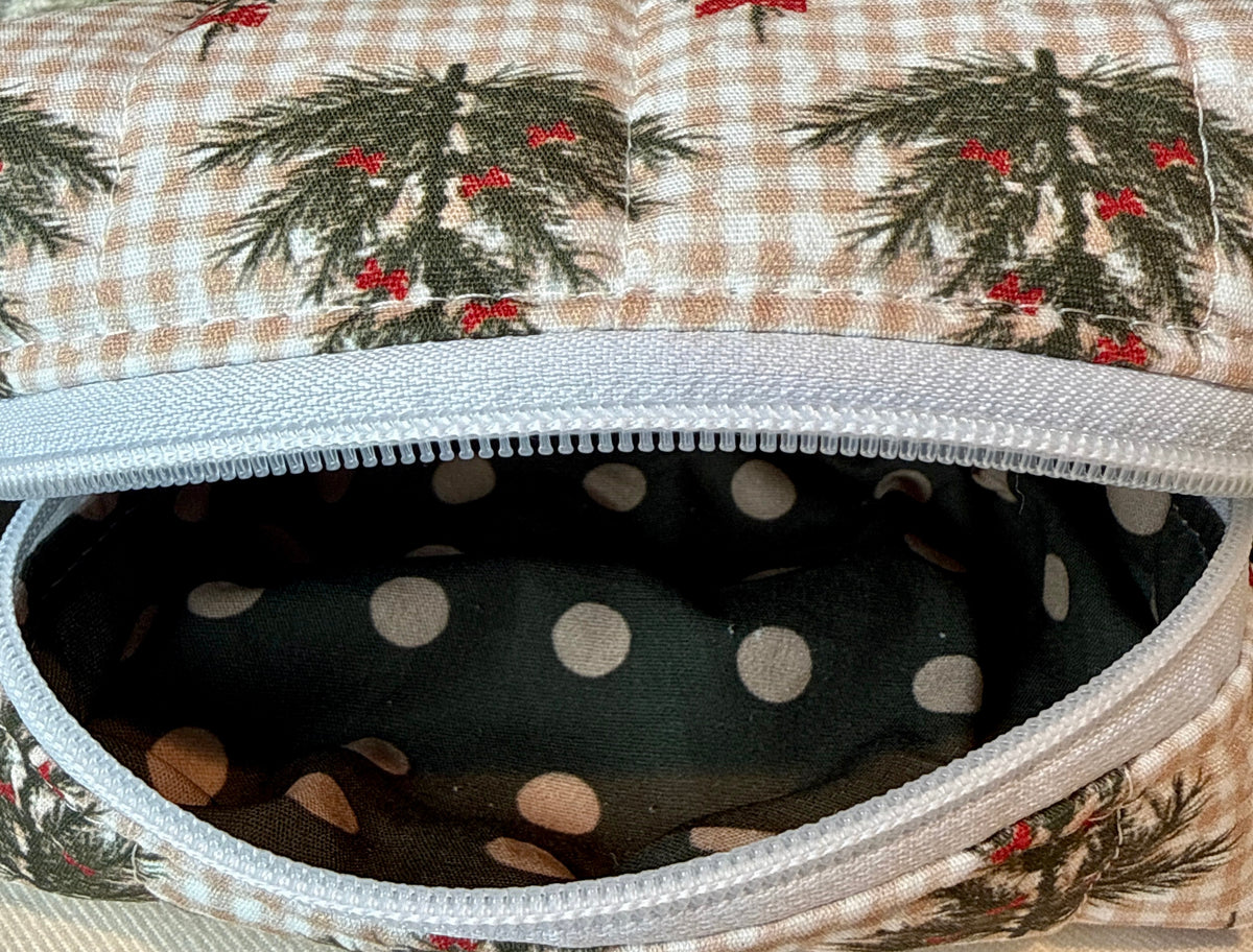 Open bag showing the dark lining with white polka dots