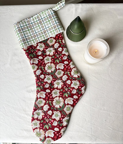 Full-length handmade Berry Blossom Christmas stocking with a burgundy floral body, green-and-cream plaid cuff, and matching hanging loop.