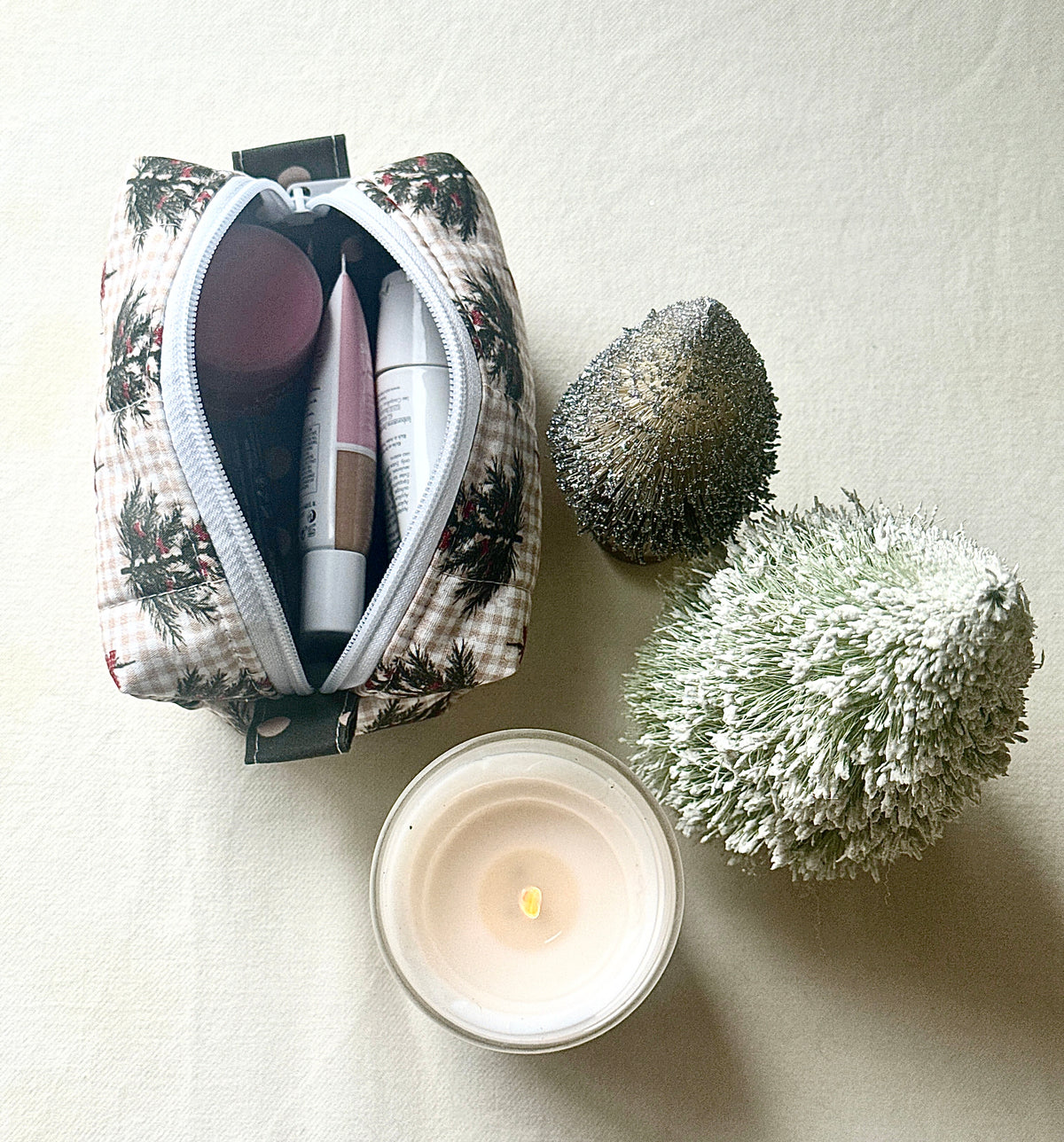Open Winter Sprig boxy bag holding makeup and toiletries