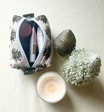 Open Winter Sprig boxy bag holding makeup and toiletries