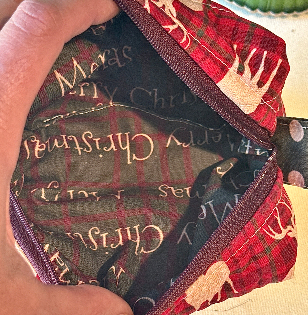 Close-up of the dark lining with “Merry Christmas” lettering inside the bag
These are suggested descriptions only, not saved to the images.