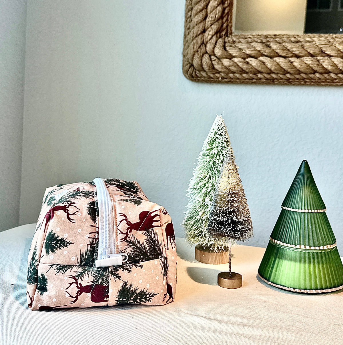 Side view of the Winter Stag boxy bag showing its depth and white zipper.