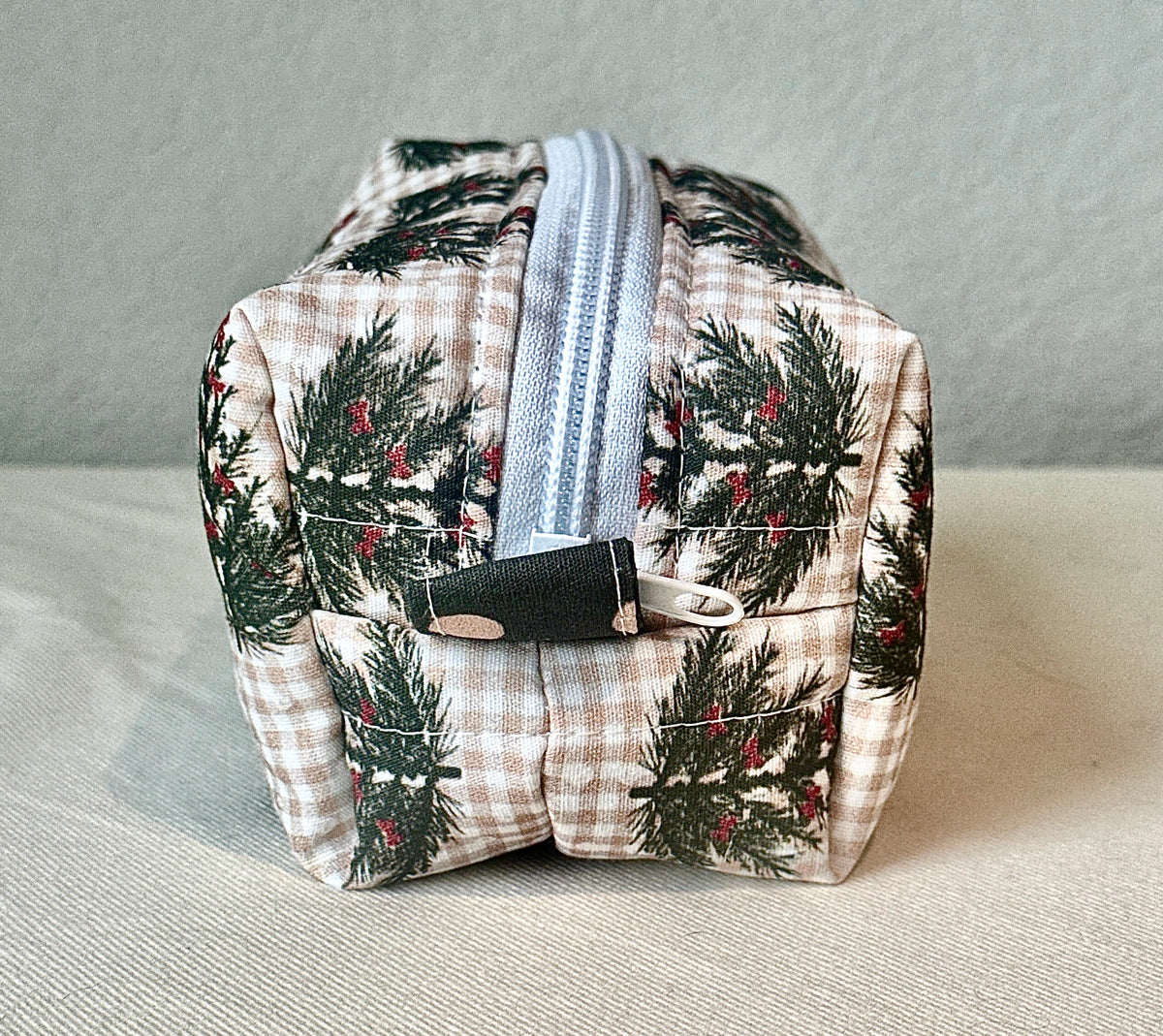 Winter Sprig boxy bag styled with miniature winter trees and a candle