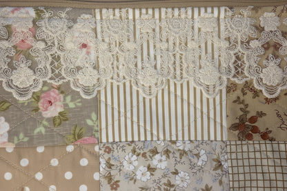 Close-up of outer fabric and lace trim.